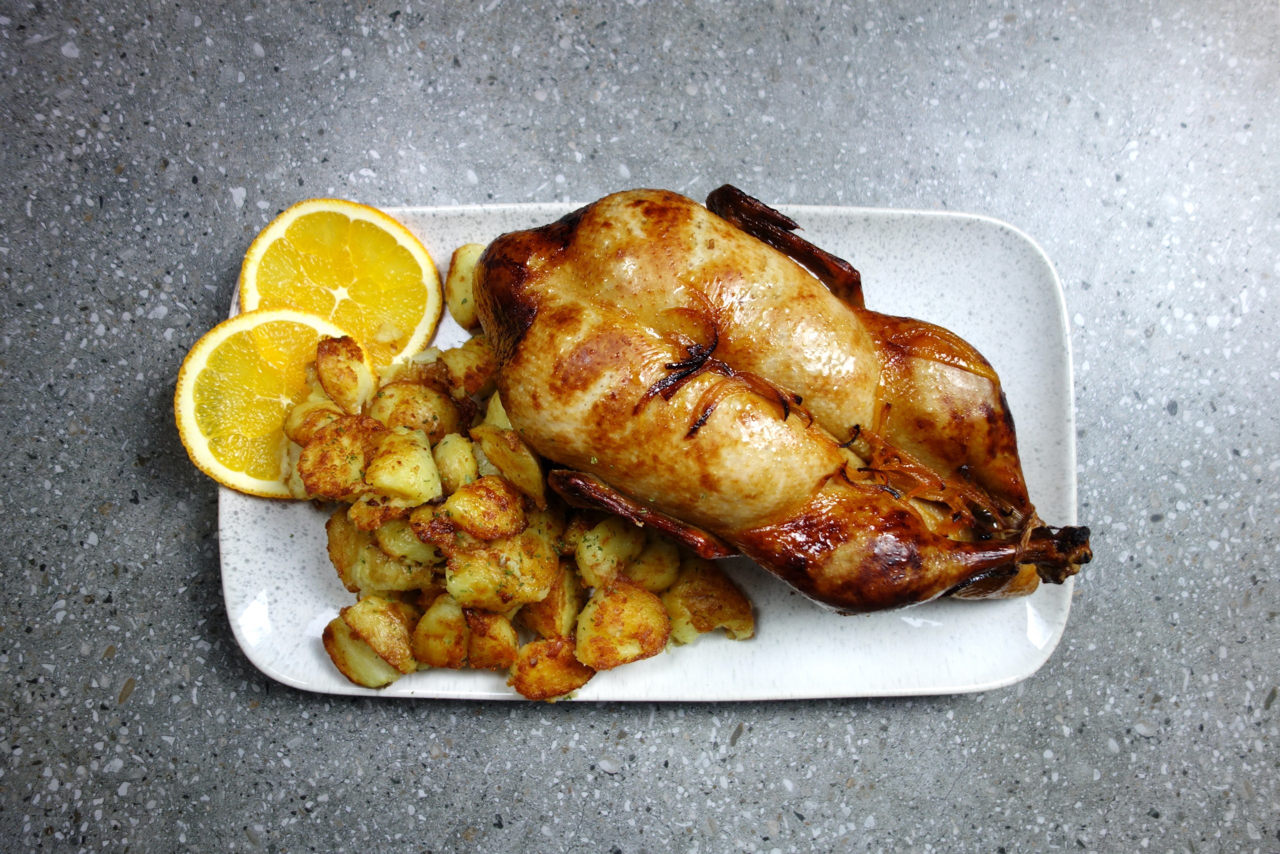 duck with orange sauce served with roast potato's