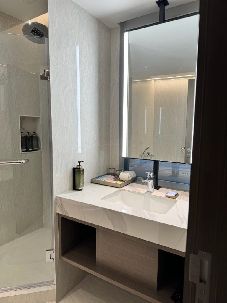 Elegant Bathroom Vanity in Grand Deluxe Room at Pathumwan Princess Hotel