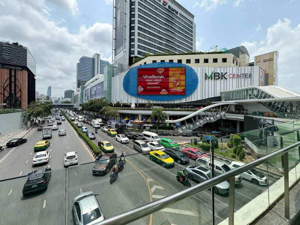 View of Bangkok’s MBK Center from the elevated skywalk directly connected to Pathumwan Princess Hotel.