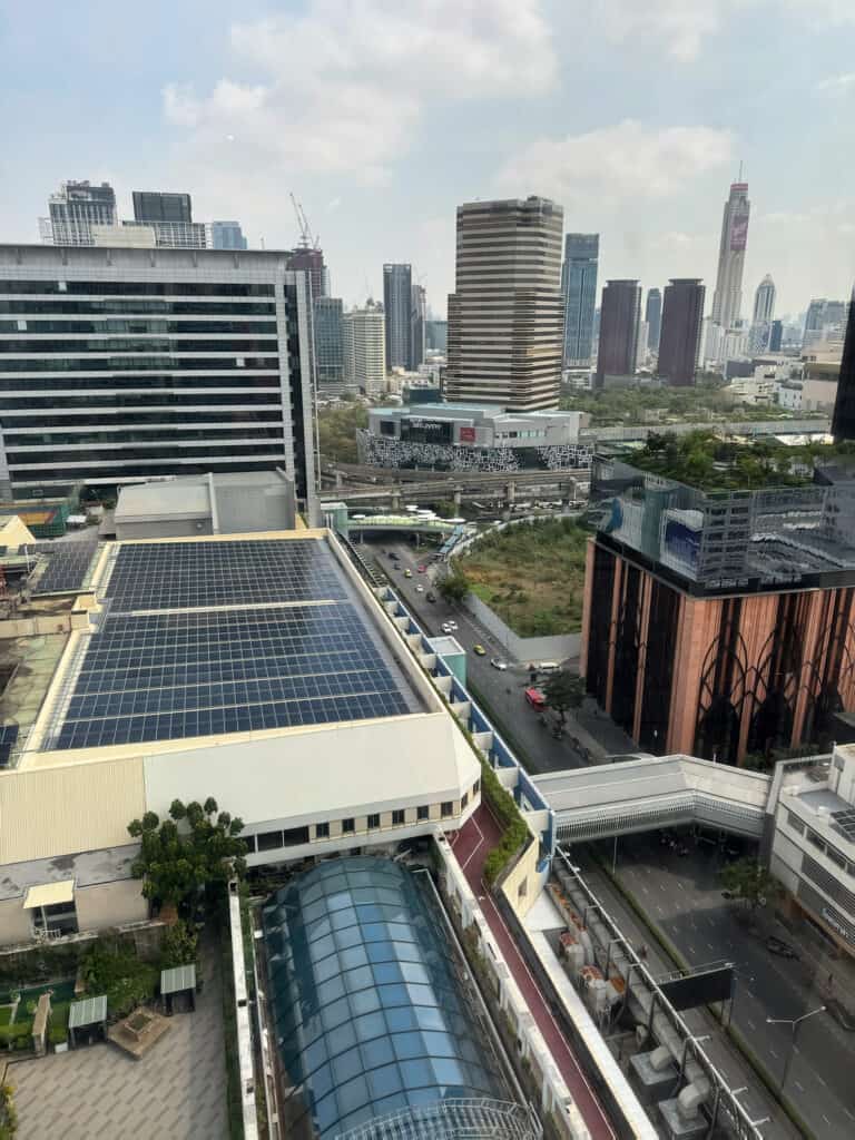 View from Grand Deluxe King Room at Pathumwan Princess Hotel during the day, looking toward Bangkok skyline