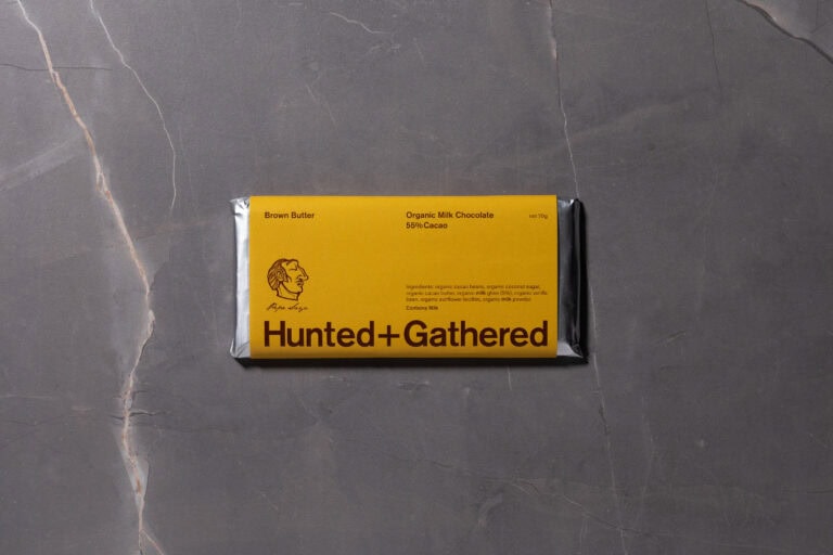Hunted + Gathered Milk Chocolate + Brown Butter 55% Cacao bar on grey marble surface