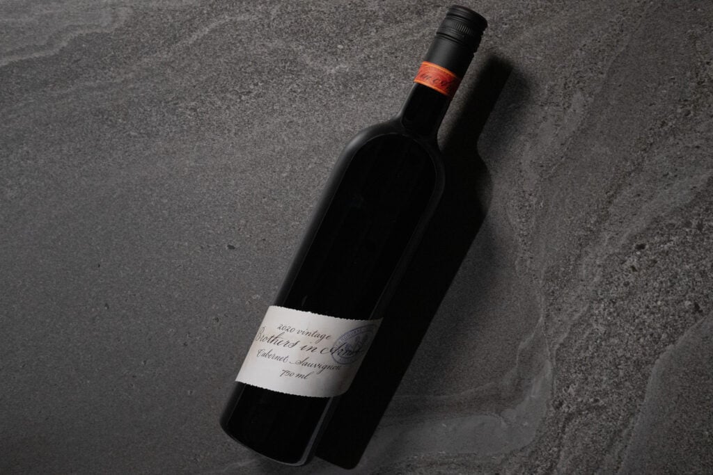 Brothers in Arms Cabernet Sauvignon 2020 bottle lying on textured stone