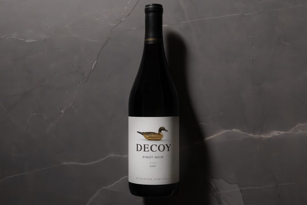 Decoy Pinot Noir 2021 bottle on grey marble background