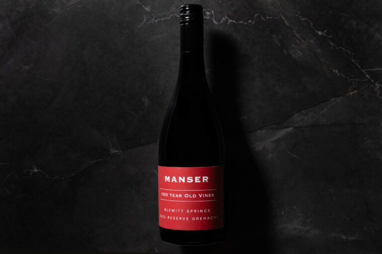 Manser 100 Year Old Vines Reserve Grenache 2022 bottle on dark stone background