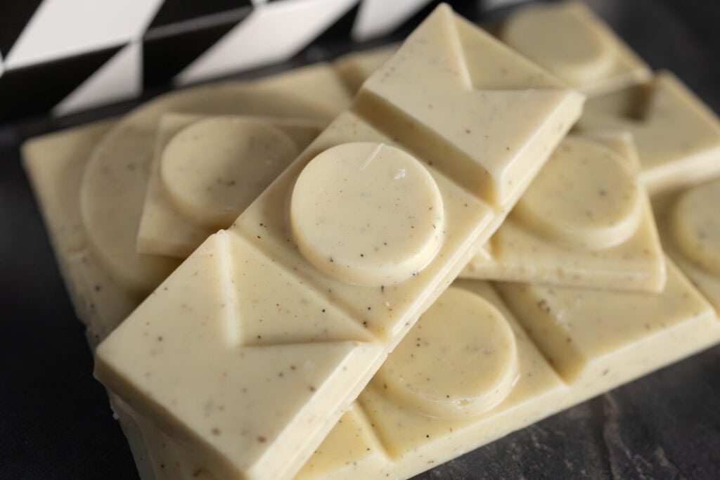 Close-up of pink salted vanilla white chocolate pieces from Koko Black