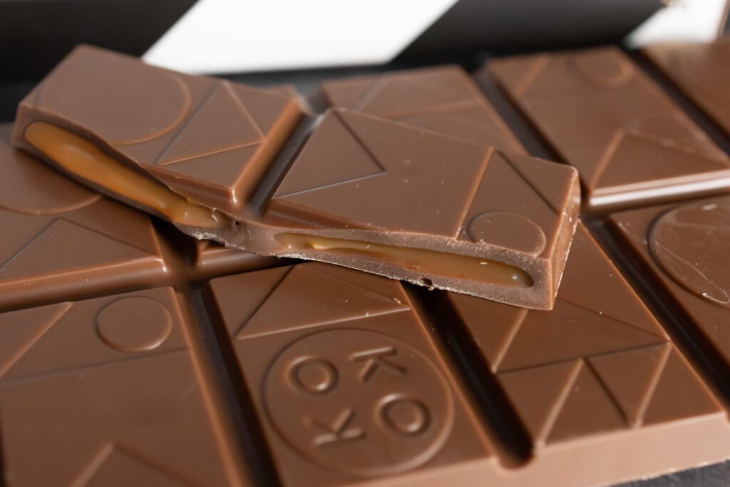 Close-up of Koko Black Salted Caramel Surprise chocolate showing smooth milk chocolate and filled segments