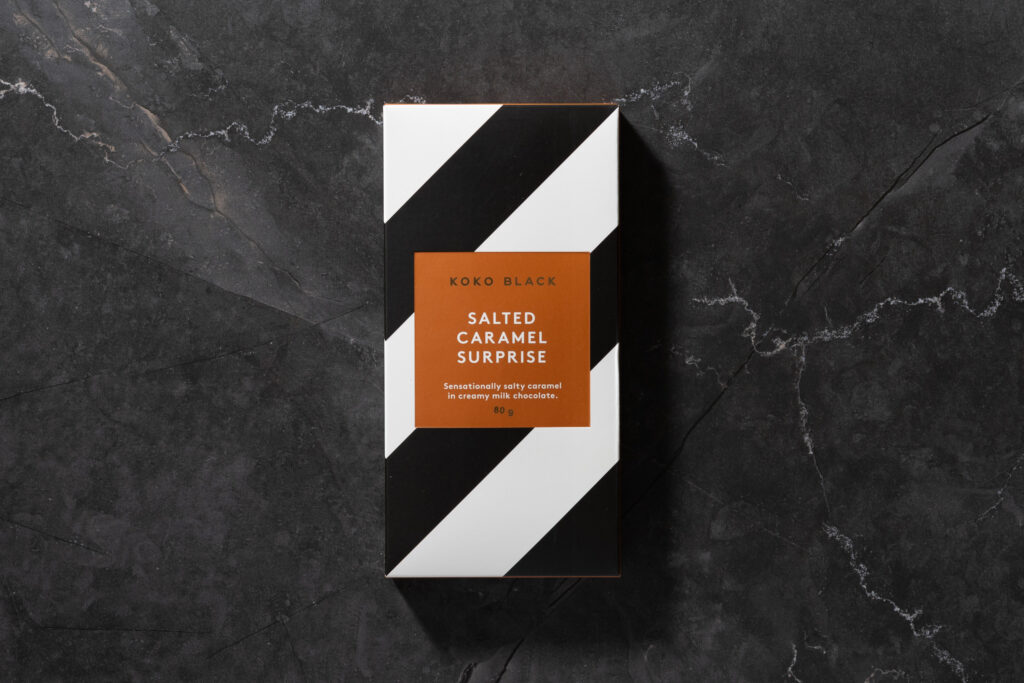 Koko Black Salted Caramel Surprise chocolate bar in black and white striped packaging