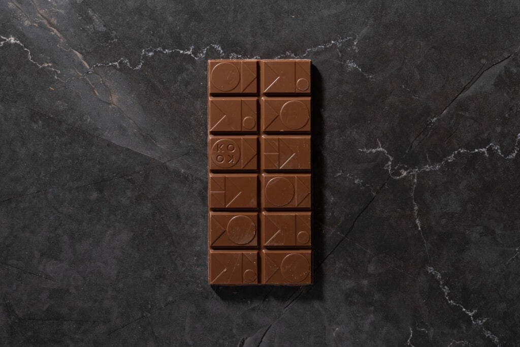 Top view of Koko Black Salted Caramel Surprise milk chocolate bar with segmented squares