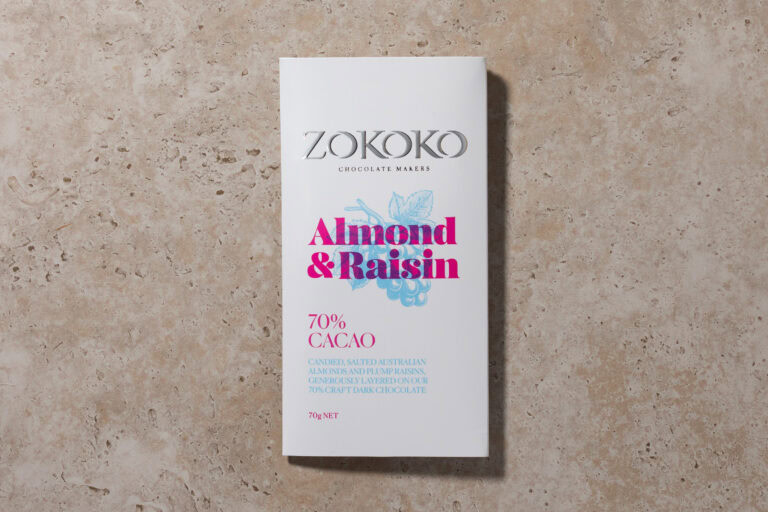 Zokoko Almond & Raisin 70% chocolate packaging on a stone surface