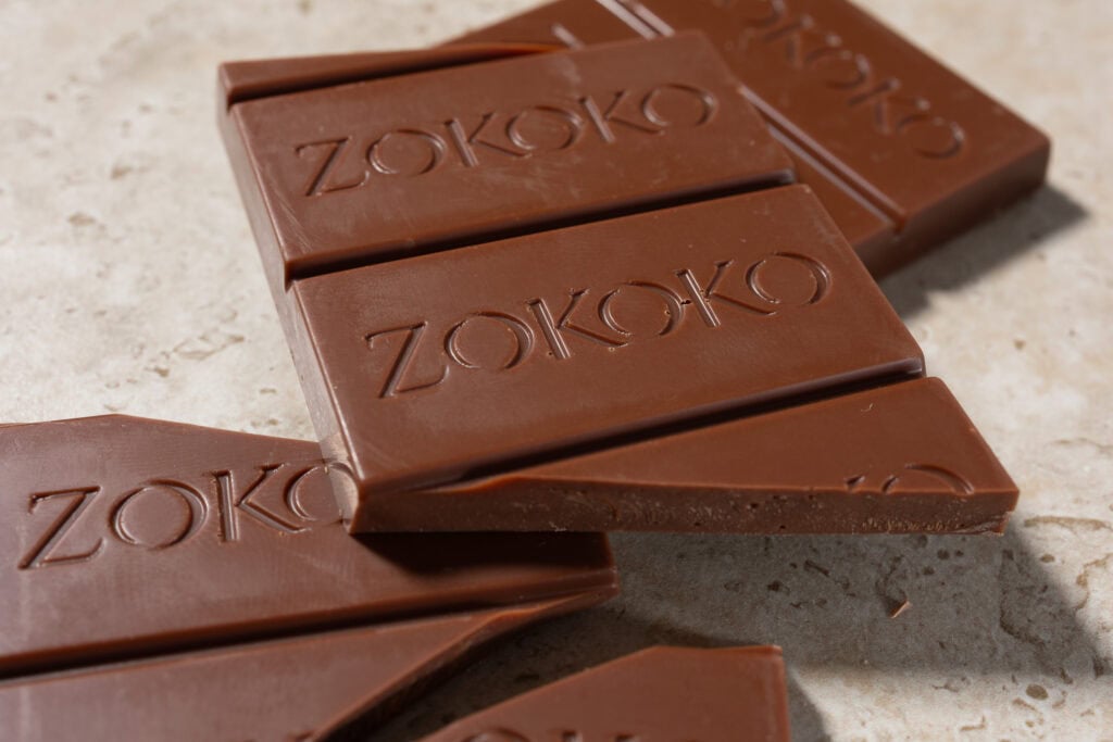 Close-up of Zokoko Chale Milk chocolate showing embossed detail and thickness
