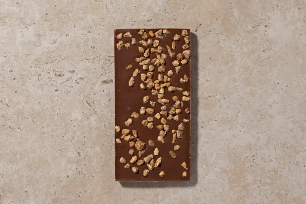 Back of Zokoko Coffee Pecan milk chocolate bar with candied pecan pieces