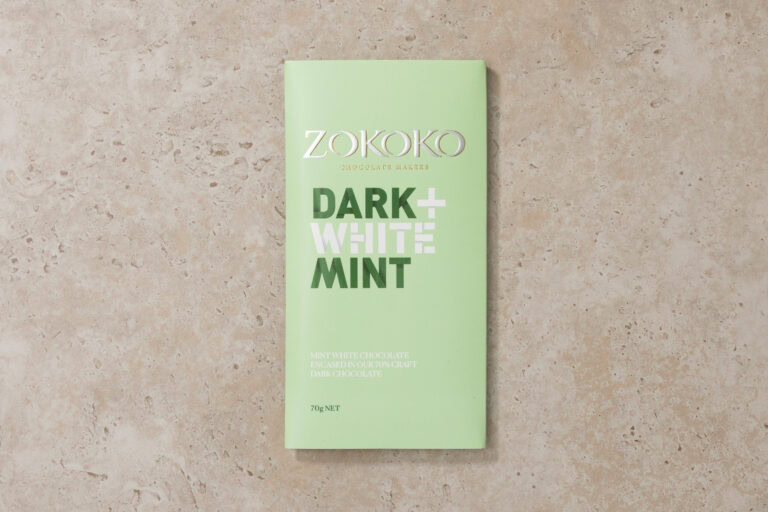 Zokoko Dark + White Mint chocolate bar packaging on stone background