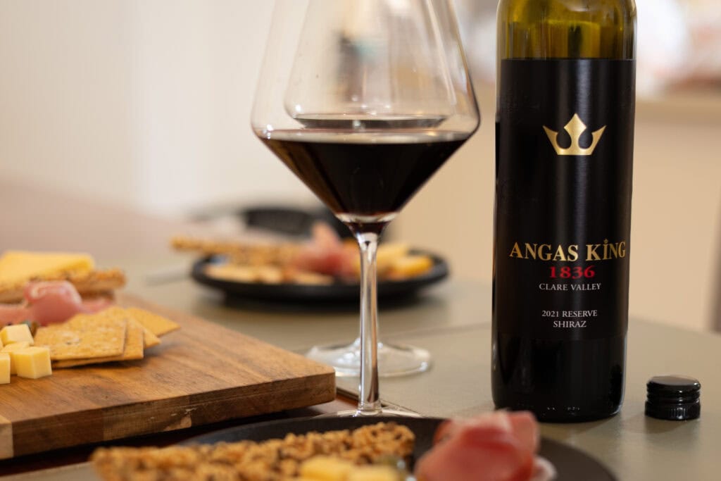 Angas King 1836 Reserve Shiraz 2021 served with cheese and cured meats during tasting