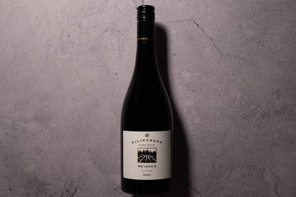 Bottle of Kilikanoon Meyman’s Shiraz 2020 against a grey stone backdrop