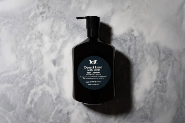 Leif Desert Lime Vanilla and Orange Body Cleanser bottle on a white and grey marble background