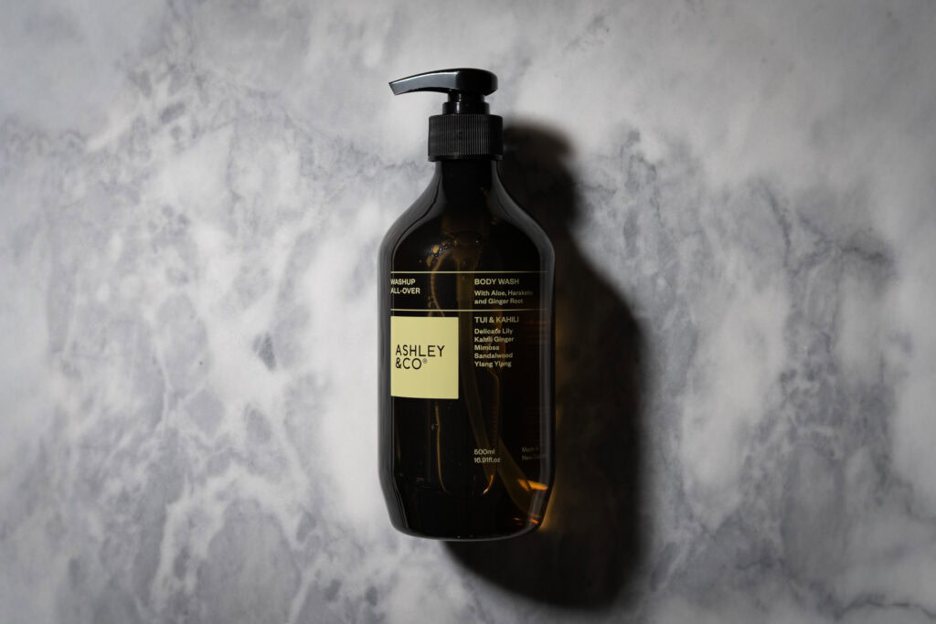 Ashley & Co Washup All Over Tui & Kahili Body Wash 500ml bottle on a marble surface
