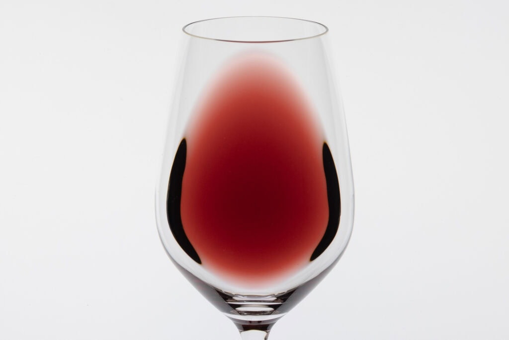 Devil’s Corner Resolution Pinot Noir 2024 showing colour and clarity in a wine glass against a white background