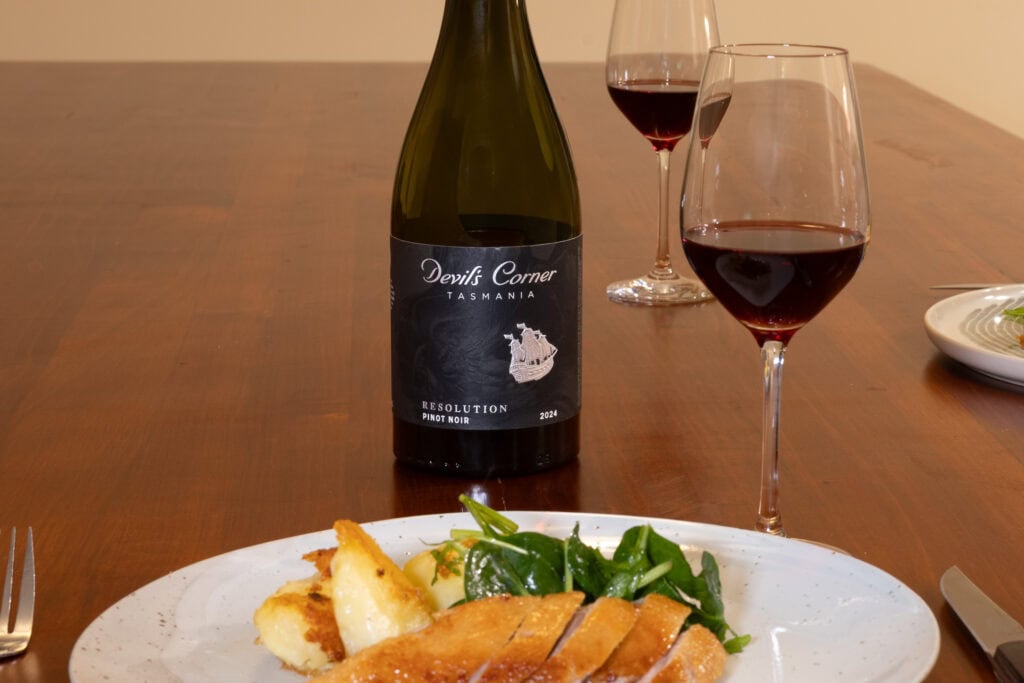 Devil’s Corner Resolution Pinot Noir 2024 served with roasted duck breast, roast potatoes and spinach salad