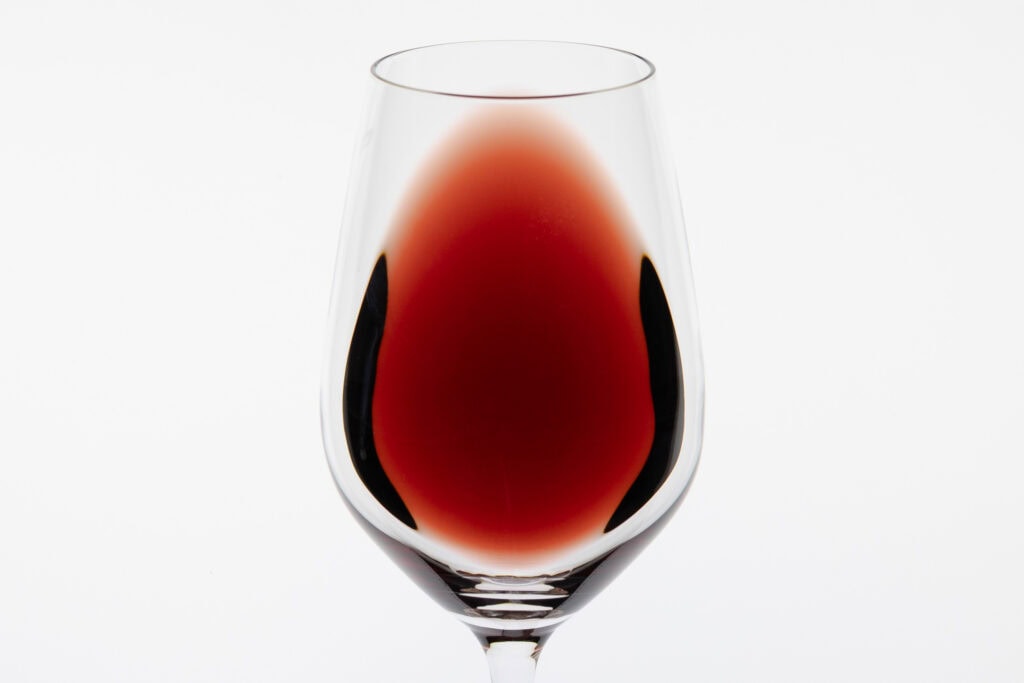 Freycinet Vineyard Pinot Noir 2023 showing transparent ruby colour and lighter rim in the glass