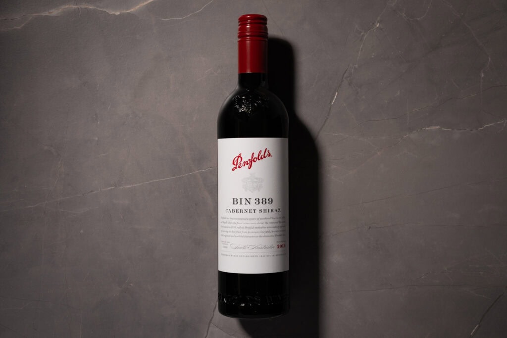 Penfolds Bin 389 Cabernet Shiraz 2018 bottle photographed on a dark stone surface