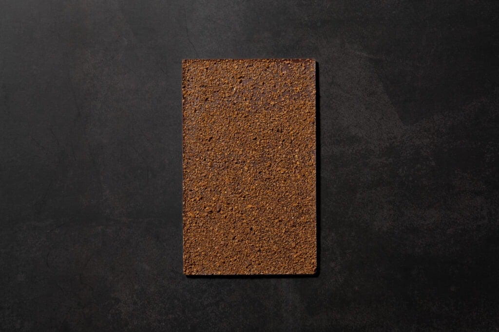 Reverse side of Ratio Axil Coffee Dark Chocolate covered with roasted coffee pieces