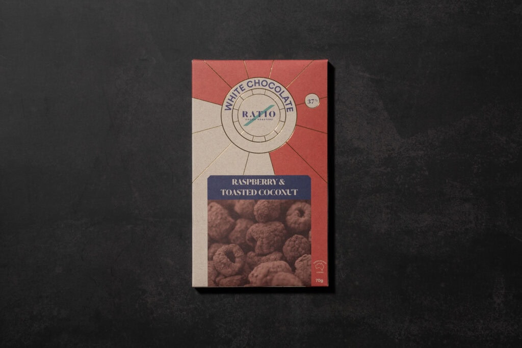Ratio Raspberry & Toasted Coconut White Chocolate 37% cacao packaging photographed on a dark stone background